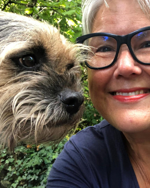 Lizzie and dog's face posing for picture